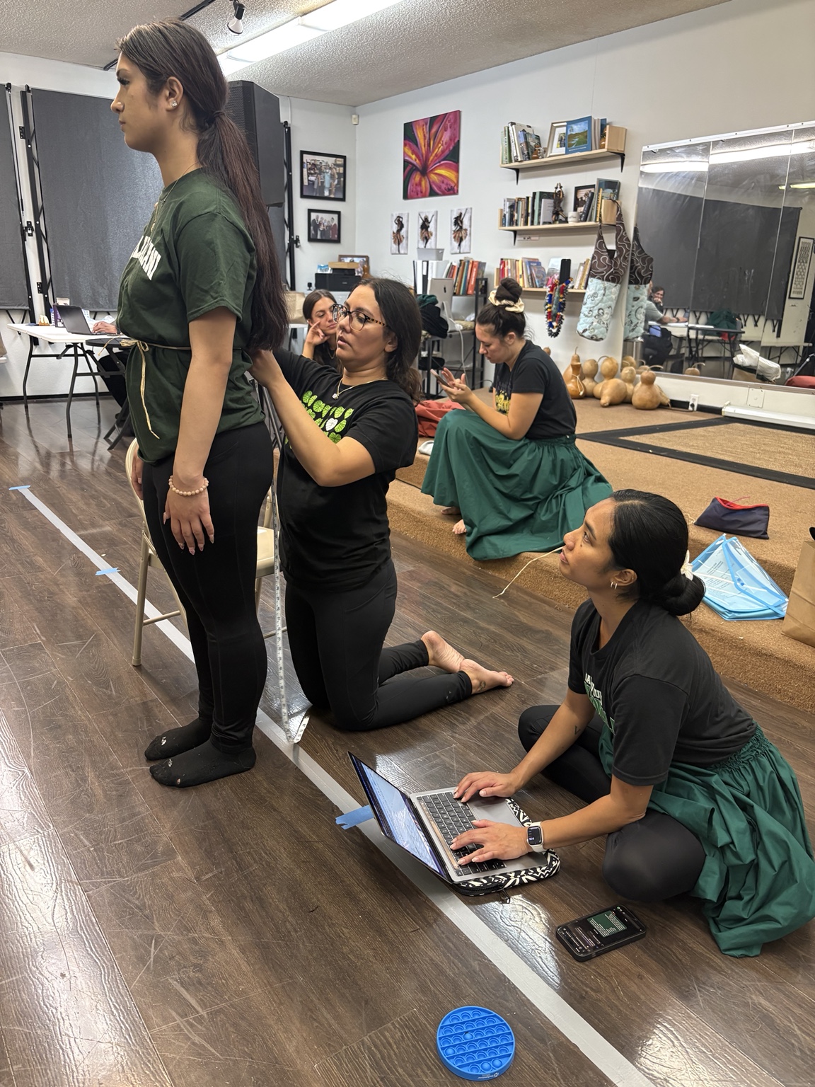Preparing attire at the hālau
